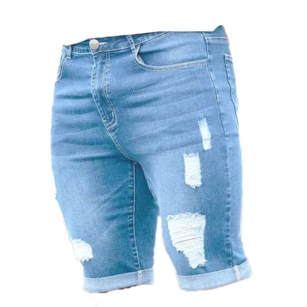 Sky blue denim shorts with distressed holes and low waist design