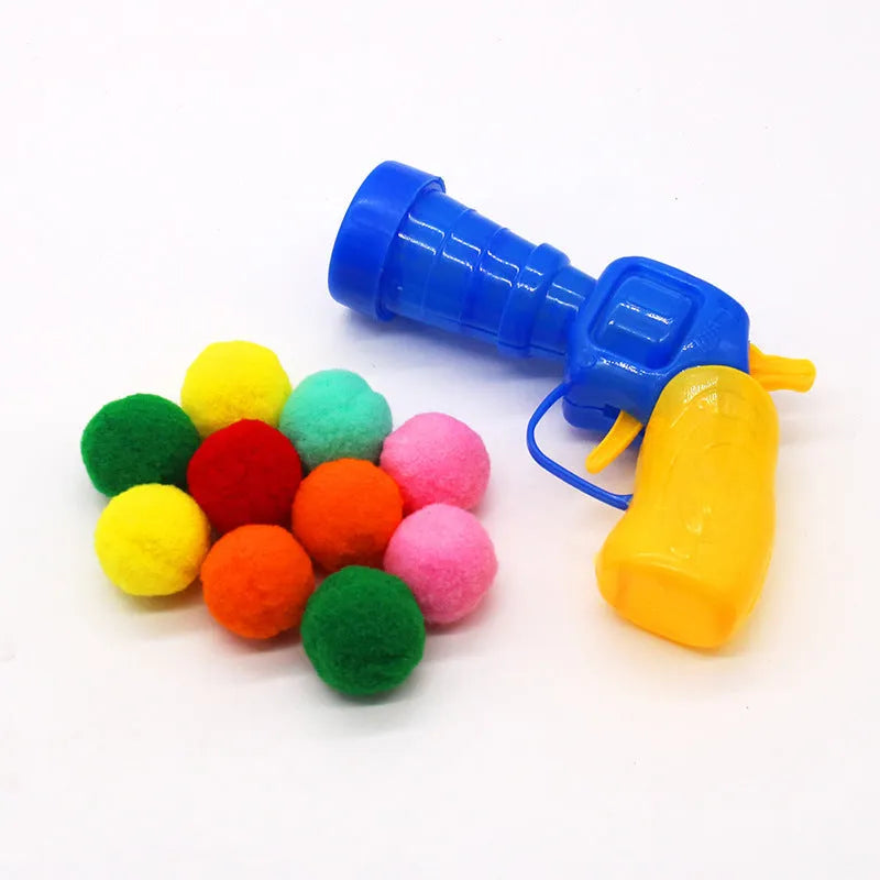 Plush pet launch gun with soft yarn balls for interactive cat and dog play sessions