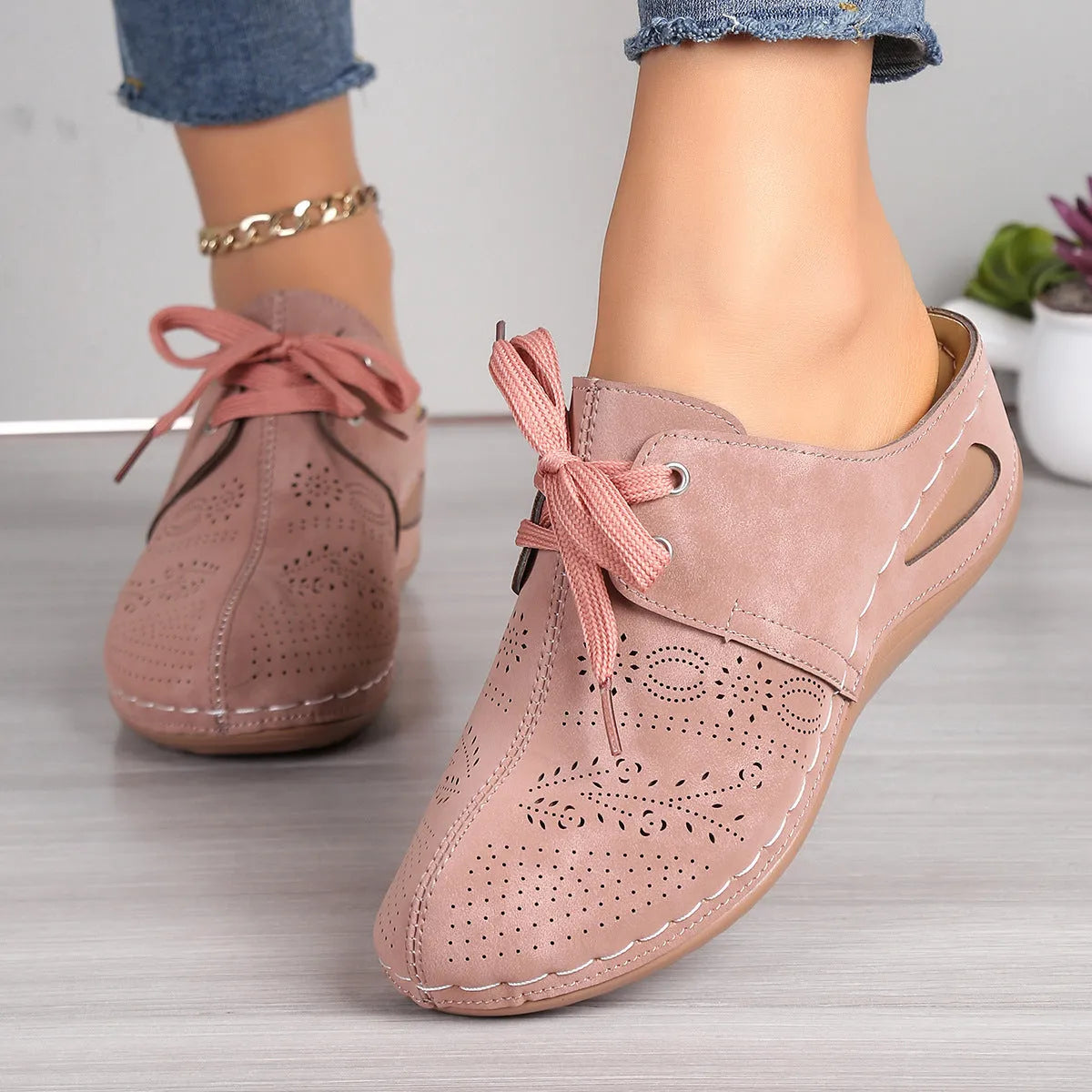 Women's lace-up Baotou slippers with hollow-out wedge design in suede material, available in multiple colours.