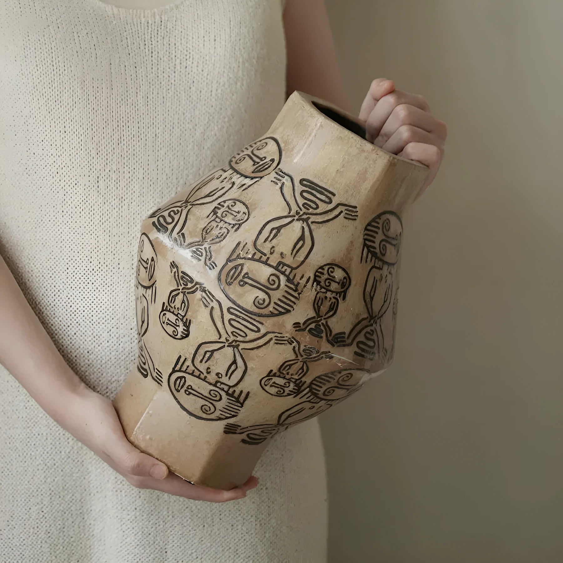 Hand-painted ceramic cylindrical vase with carved tribal totem vintage design.