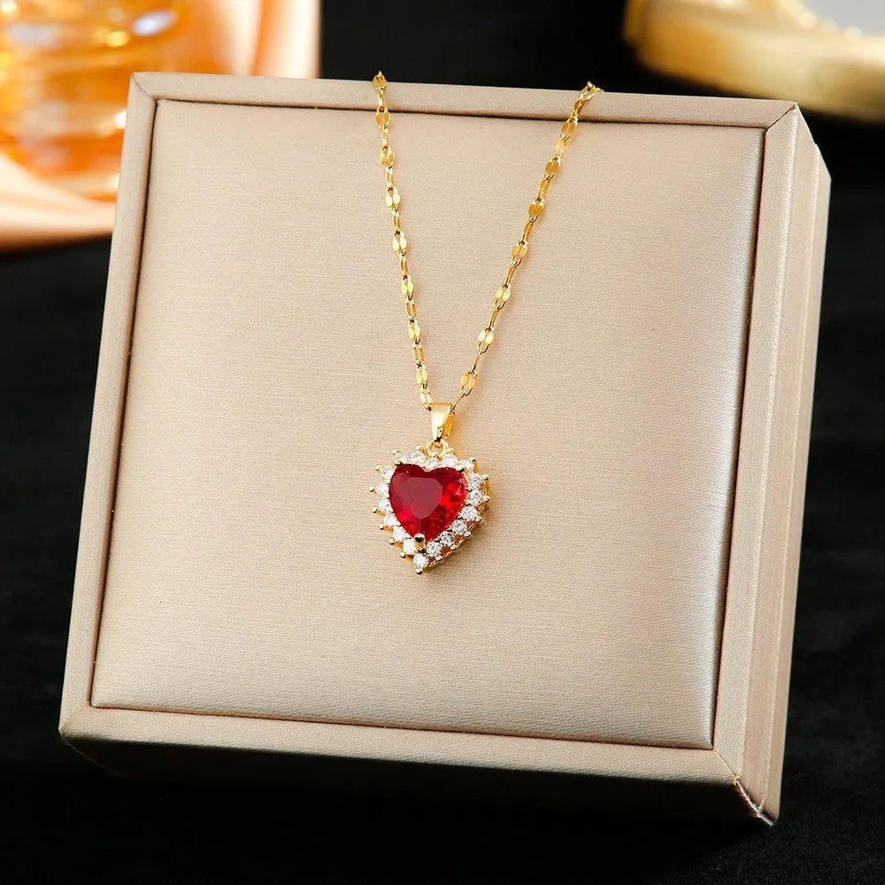 Gold-red titanium steel jewellery set with heart flower pendant necklace, stud earrings, and ring.