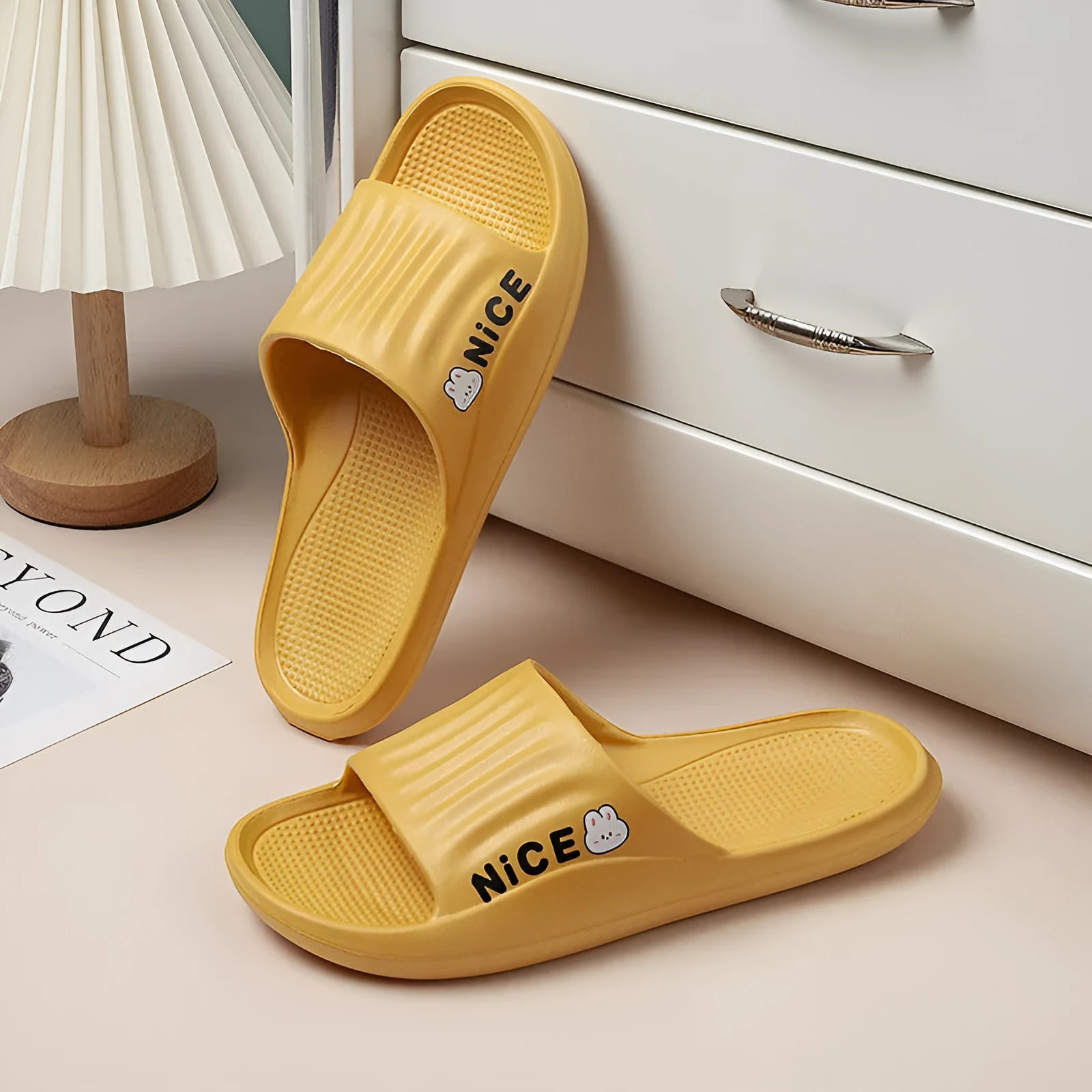 Cartoon pattern EVA flip flop slippers available in six colours for adult bathroom use