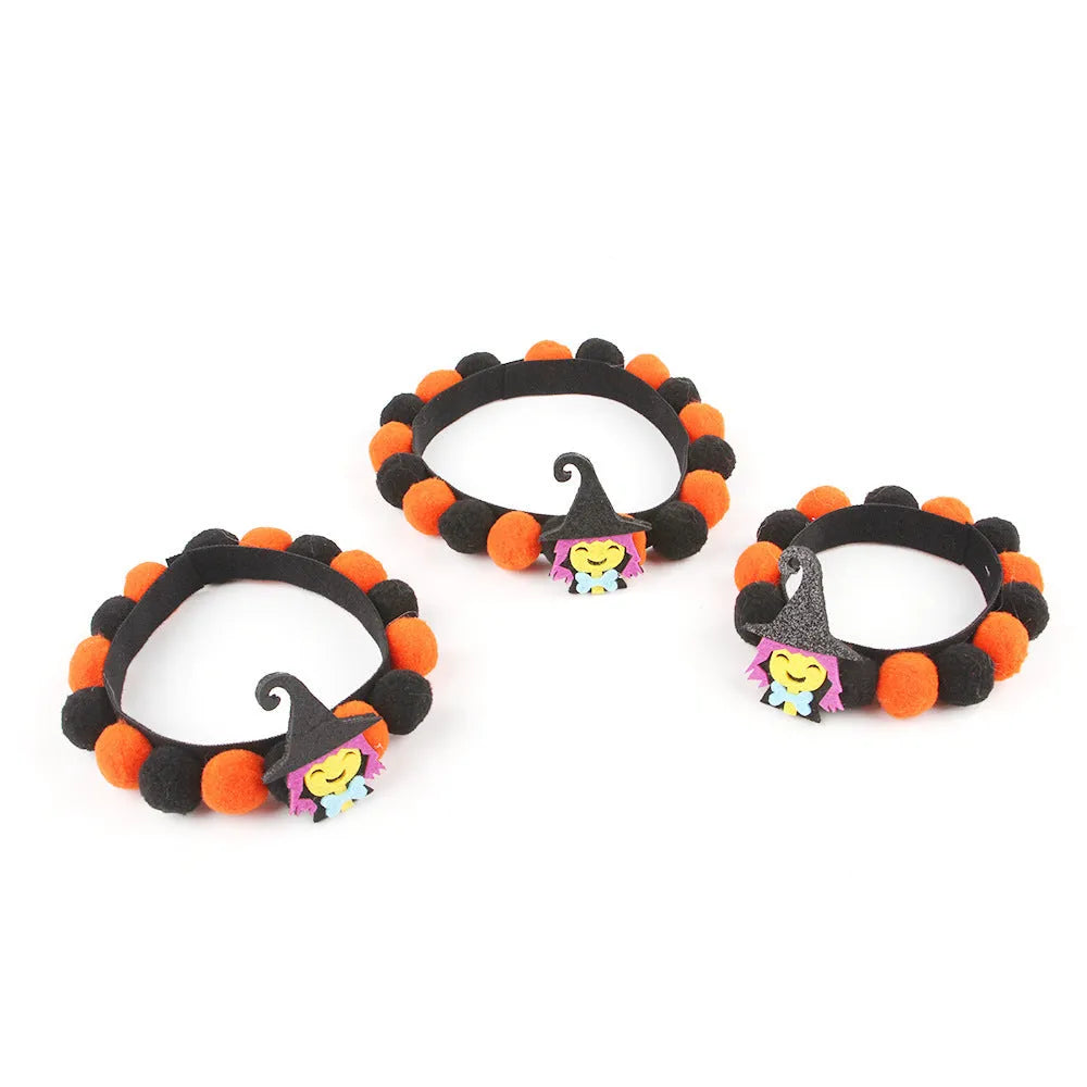 Halloween pet fur ball collar accessory for small dogs and cats in pumpkin, skull, and witch designs.