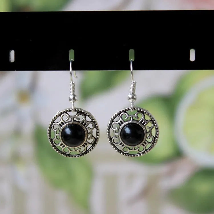 Geometric ethnic earrings with Tibetan silver and turquoise stones in traditional Miao style