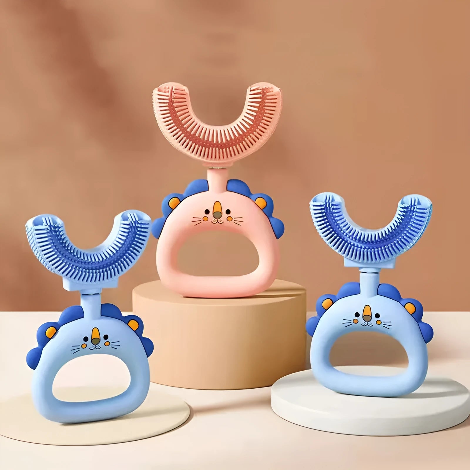 Children's U-shaped silicone toothbrush in blue and pink with little cute lion design for ages 2-14