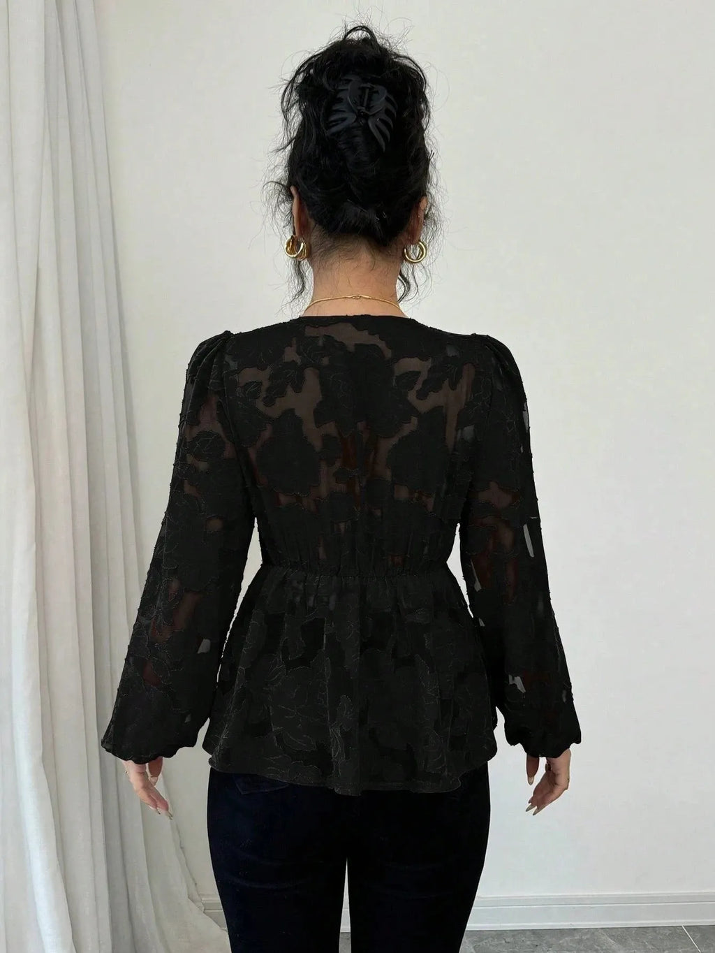 Women's black hollow out embroidery polyester shirt with V-neck and long sleeves, front view