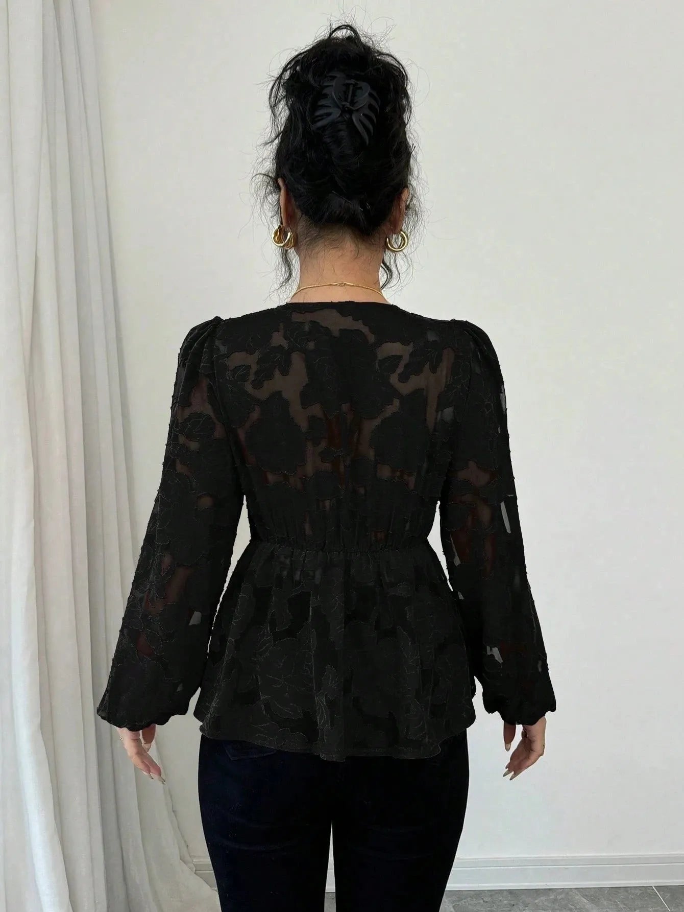 Women's black hollow out embroidery polyester shirt with V-neck and long sleeves, front view