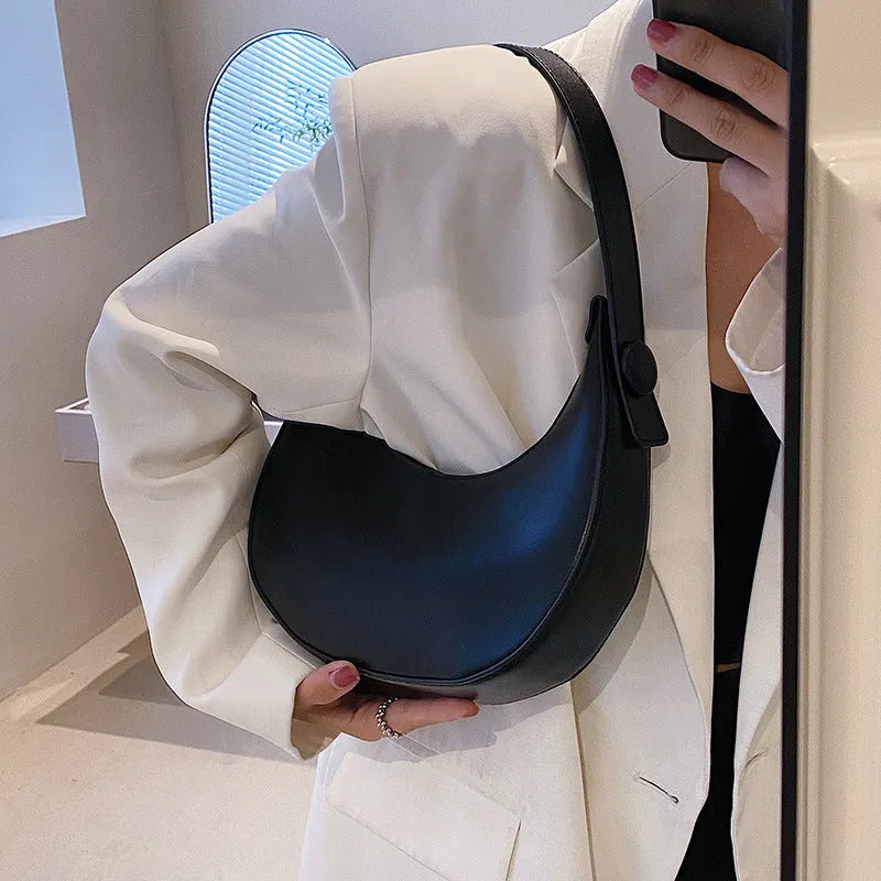 Women's retro-style PU shoulder bag in a dumpling shape, shown in one of four colours: black, cream yellow, brown, or white.