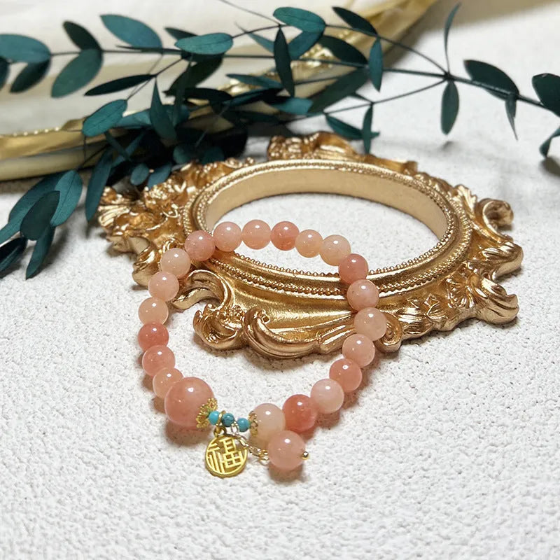 Fashion pink natural stone bracelet for women with alloy setting simple style on white background