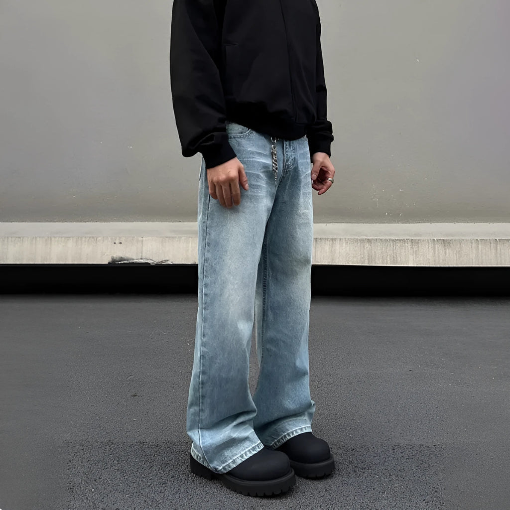 Men's blue straight leg jeans with whisker wash detail and wide leg flare