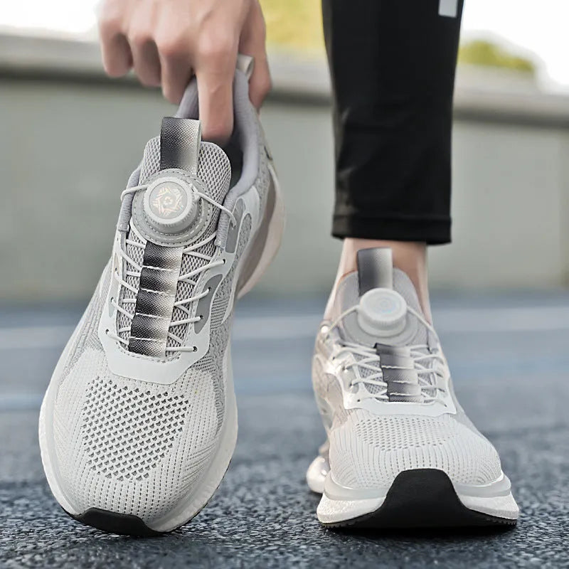 White rotating buckle running shoe with fly-kit mesh upper and low-top design on a solid background.