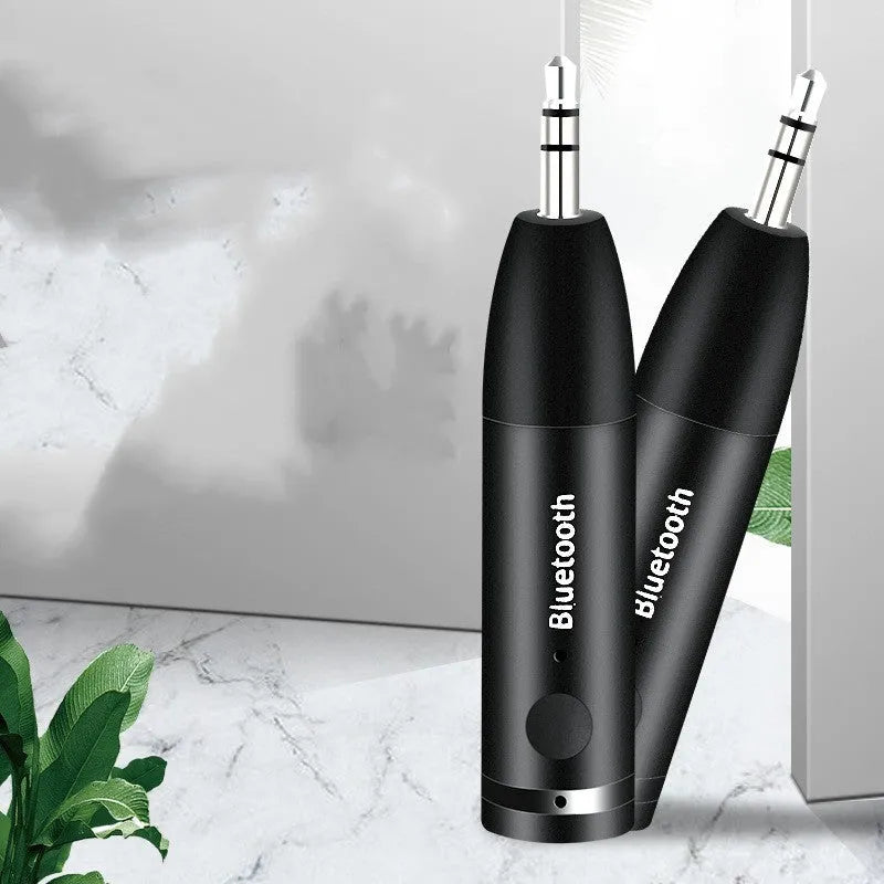 Black Bluetooth AUX receiver for car and home stereos with 70mm compact design