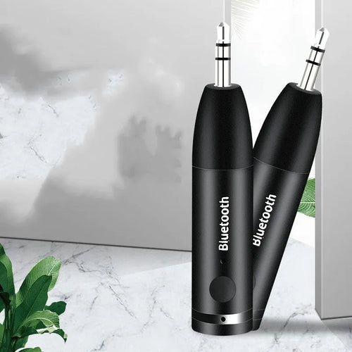 Black Bluetooth AUX receiver for car and home stereos with 70mm compact design