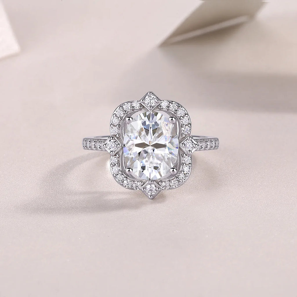 Camellia egg-shaped moissanite wedding ring set with S925 silver and platinum plating, showing centre stone and band
