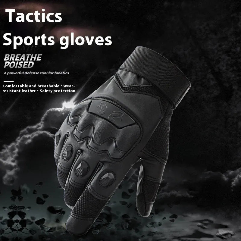 Men's black full finger tactical gloves with touch screen fingertips on a hand holding a phone.