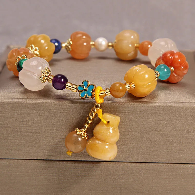 Khaki yellow agate crystal bead bracelet on an adjustable gold silk cord.