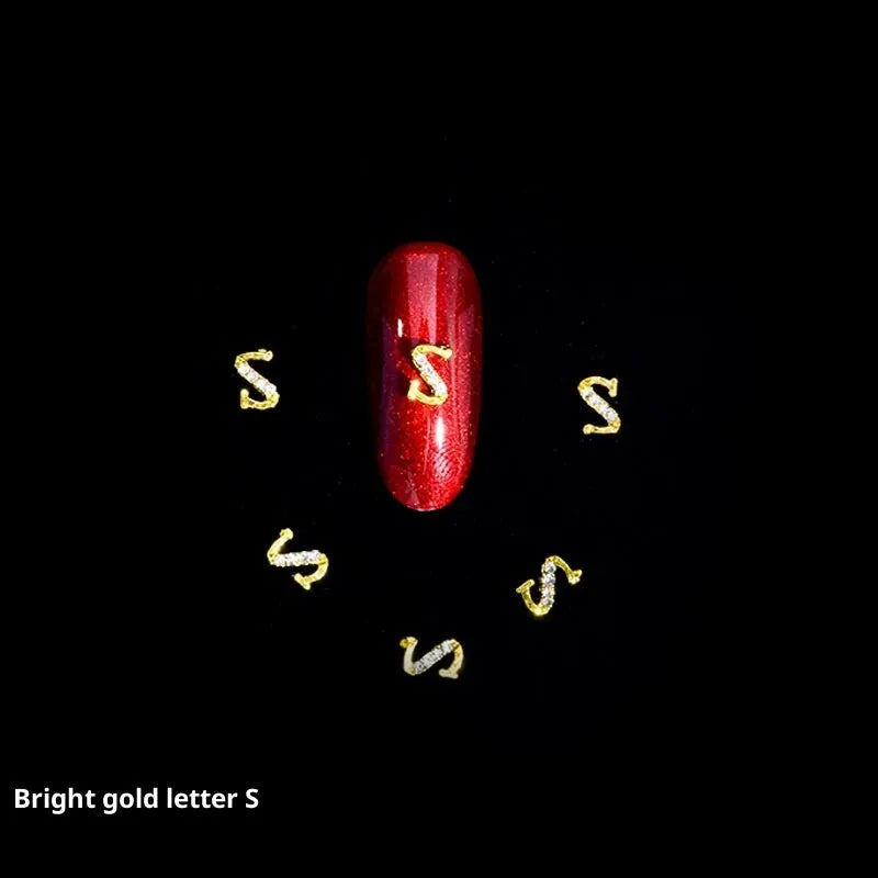 Gold alloy letter A nail ornament charm with crystal detail on a square chain base