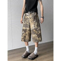 Yellow snake camouflage pattern on cropped denim jeans