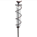 Cast iron hummingbird garden rain gauge with glass measurement tube showing 1-20cm scale