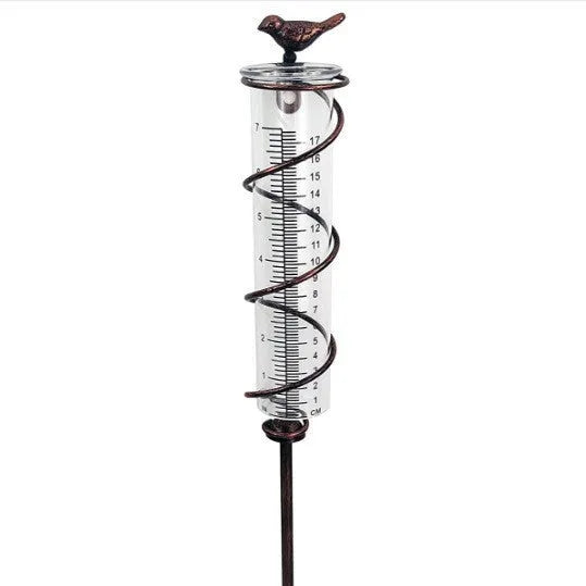 Cast iron hummingbird garden rain gauge with glass measurement tube showing 1-20cm scale