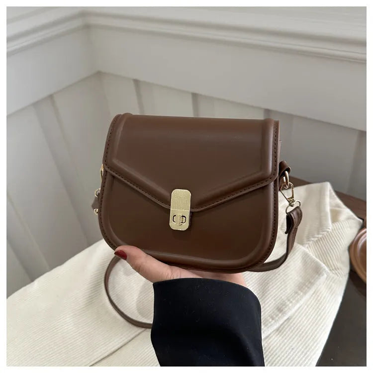 Unisex PU leather clamshell shoulder messenger bag in horizontal square design with adjustable strap