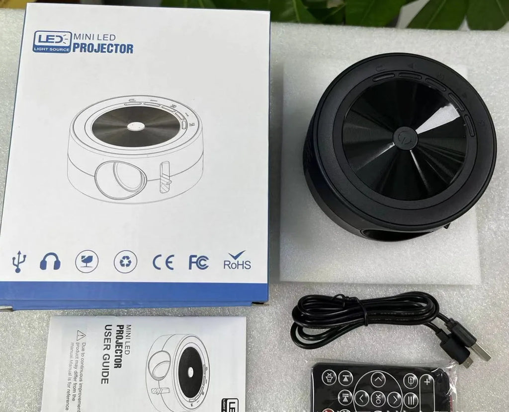 Wired home LED projector YT200 in compact 110x47mm casing with remote control and USB cord