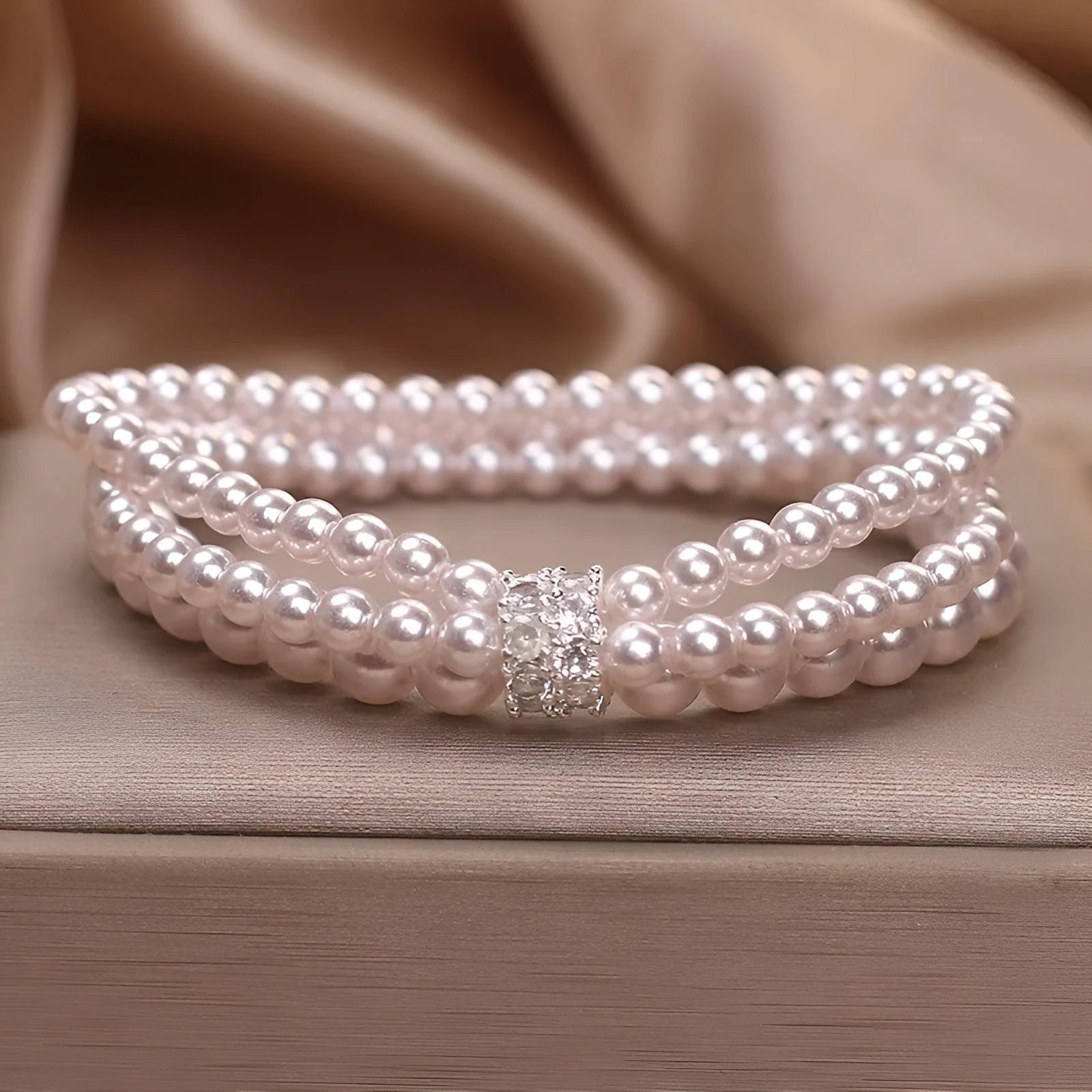 Baroque pearl multi-layer twin bracelet in white with electroplated finish on neutral background