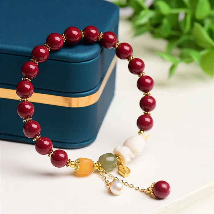 Natural red cinnabar bracelet for women featuring a carved rabbit design, shown in 8mm and 10mm width options.