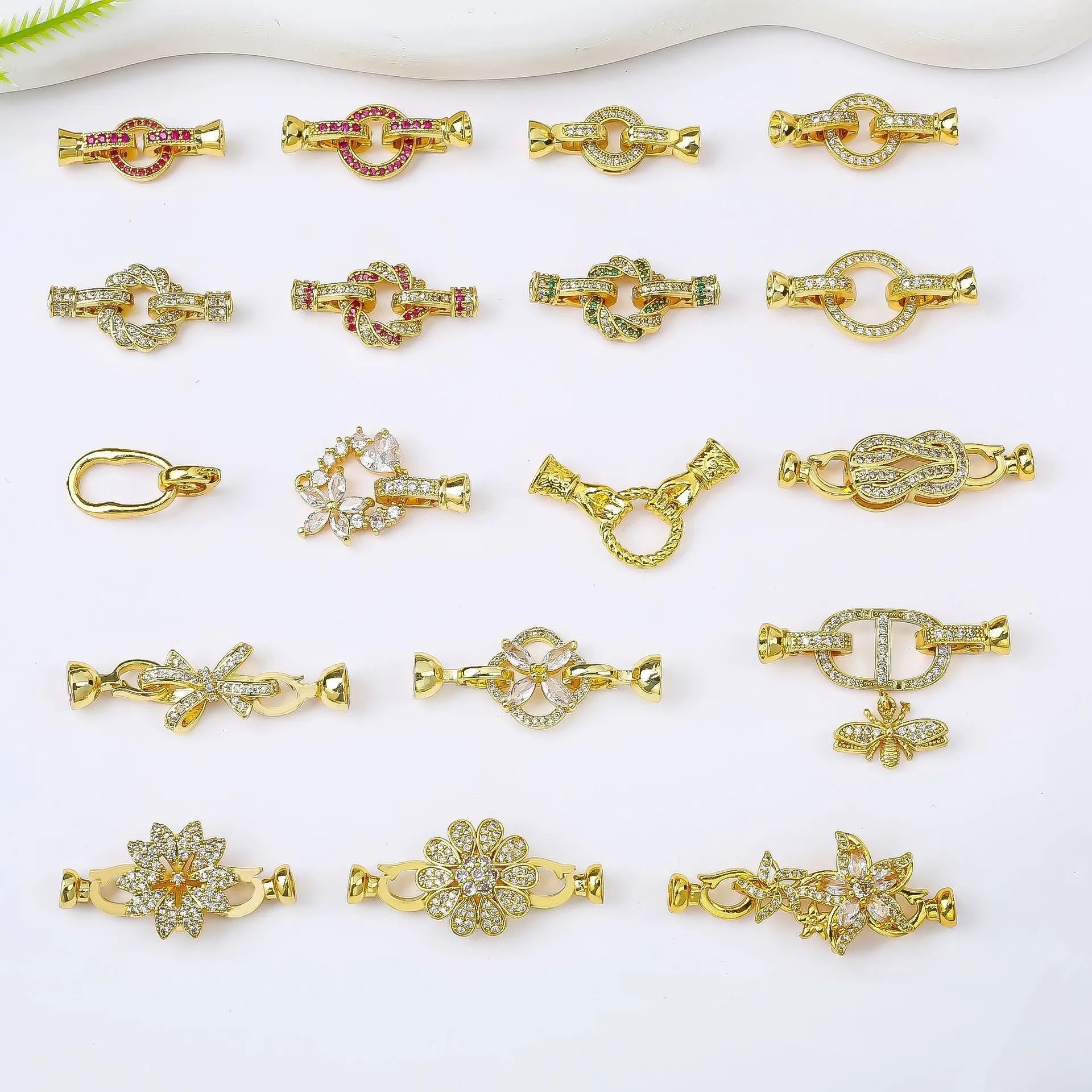 Small gold plated buckle clasp for DIY jewellery making on a white background.