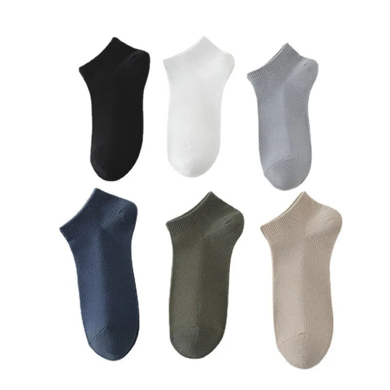 Men's low-cut solid colour boat socks made from breathable polyester, shown in one of six available colour options.