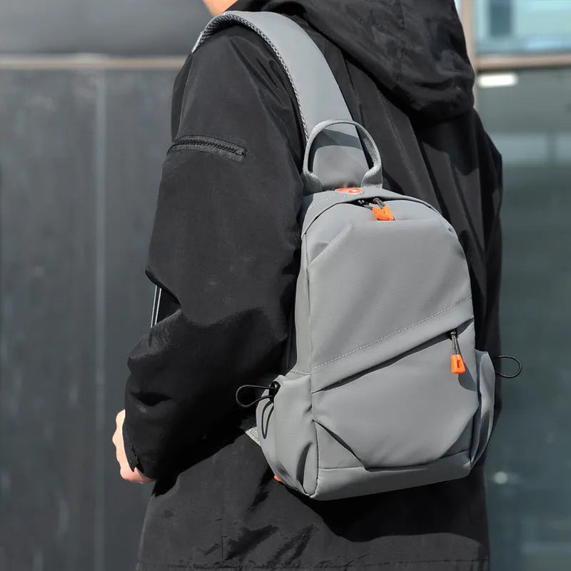 Men's black waterproof polyester crossbody bag with single shoulder strap and simple casual design