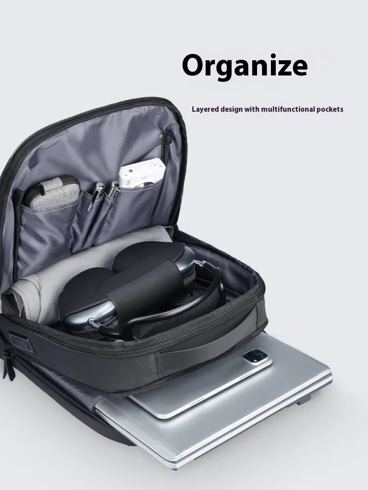 Graphite grey business backpack with USB charging port showing organised compartments and Oxford cloth material