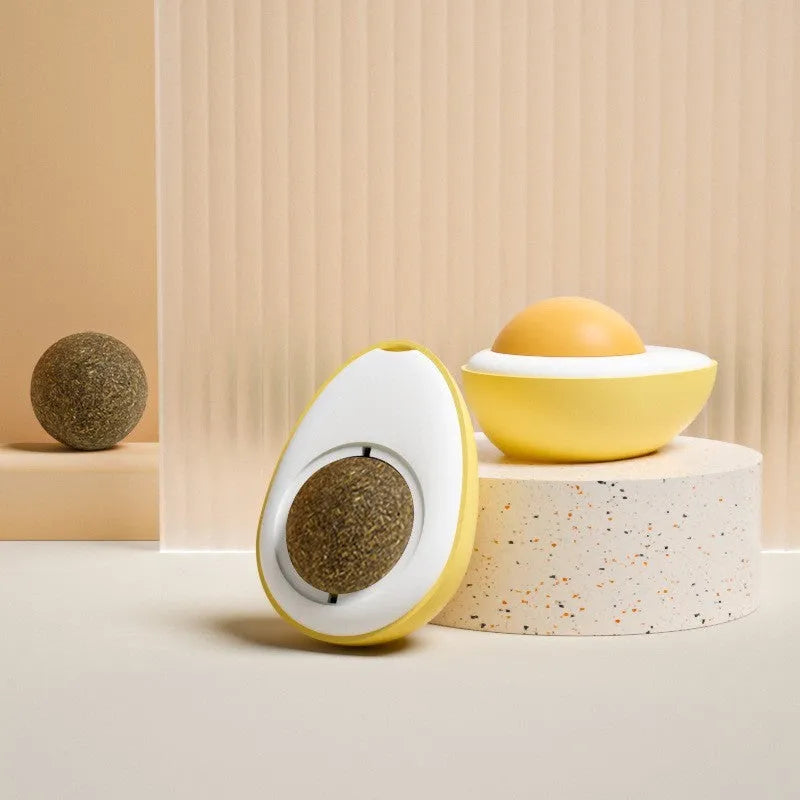 Interactive catnip ball toy with soft plush exterior mounted on wall surface