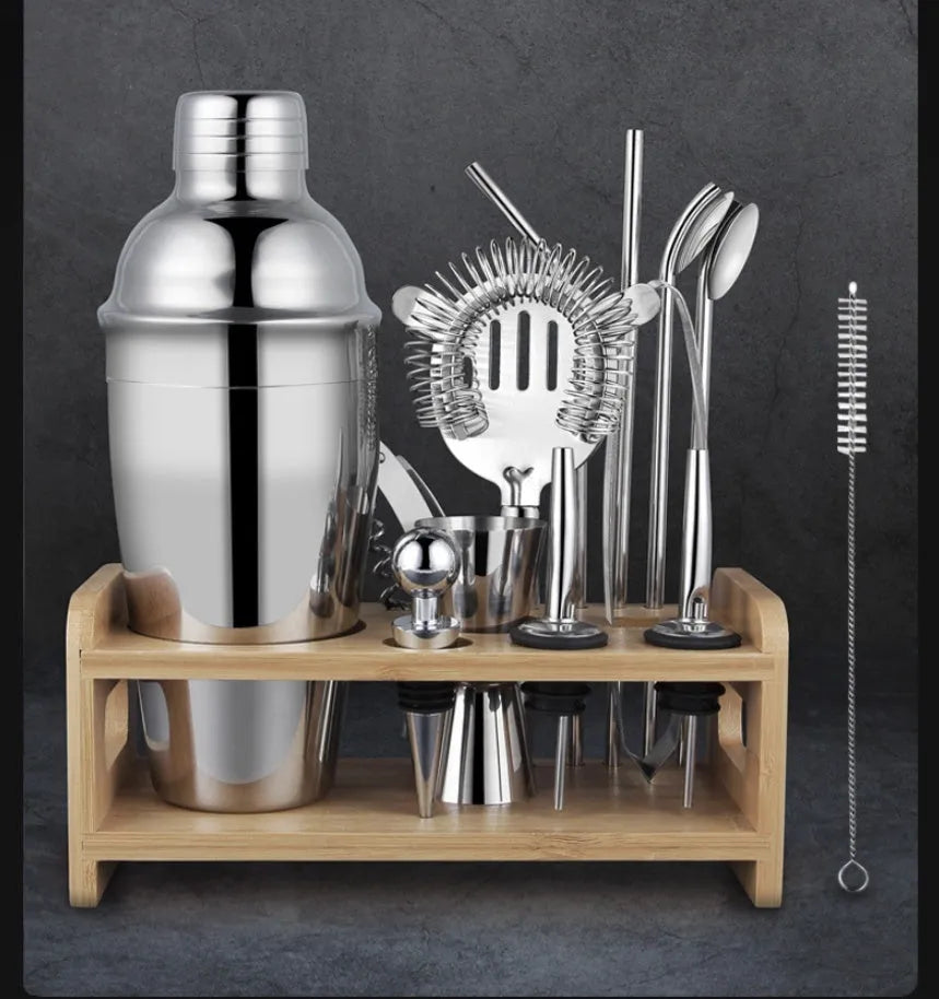 23-piece stainless steel cocktail set with shakers and bar tools on counter