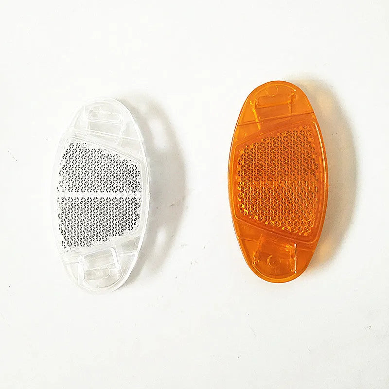 White and yellow plastic bicycle wheel spoke reflectors showing dimensions
