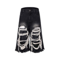 Black women's cropped wide leg jeans with distressed patches and a mid-high waist.