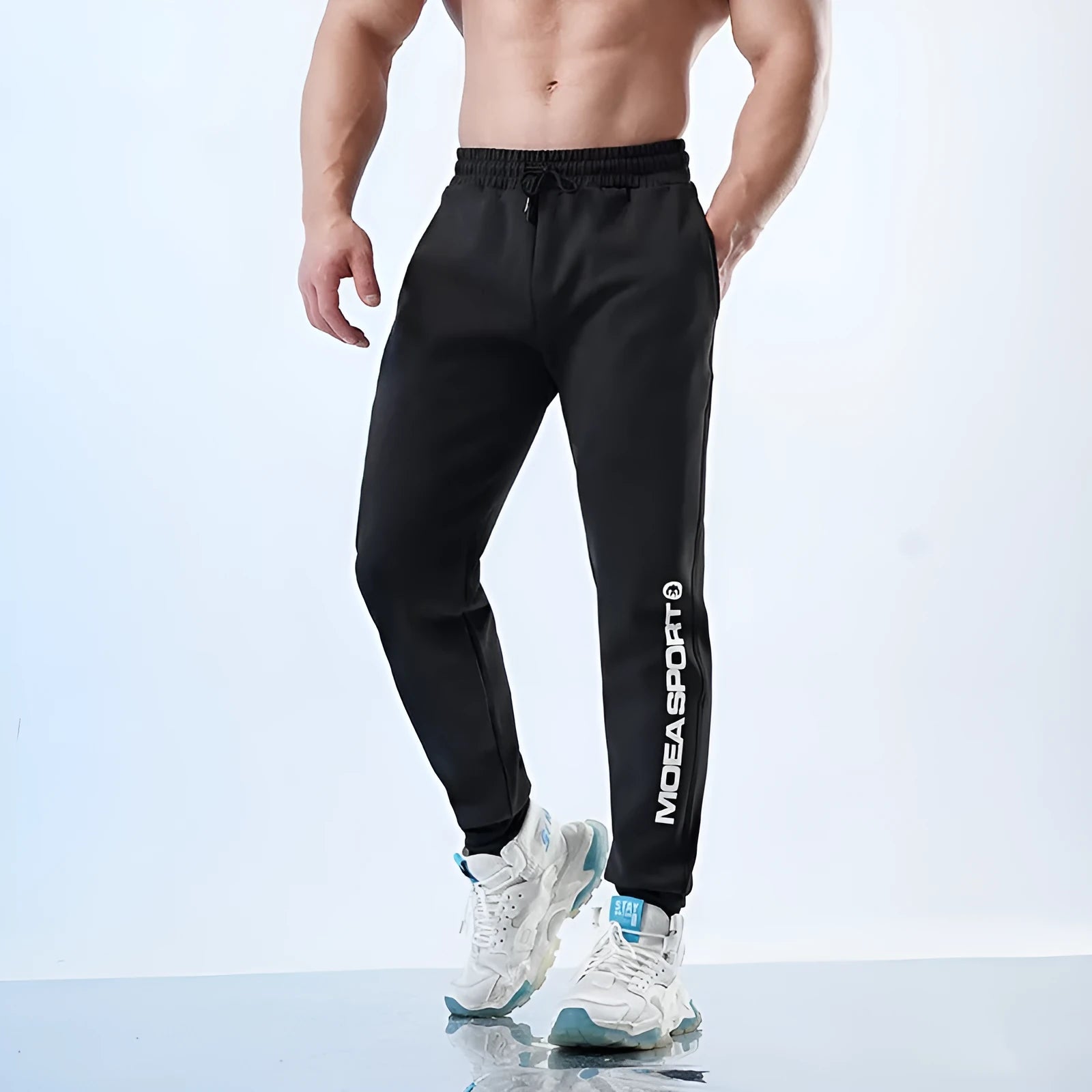Men's black air layer sweatpants with elasticated ankle cuffs and tapered fit for sports
