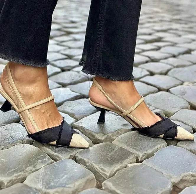 Women's apricot and black colour block stiletto heel sandals with a buckle fastening and pointed toe.