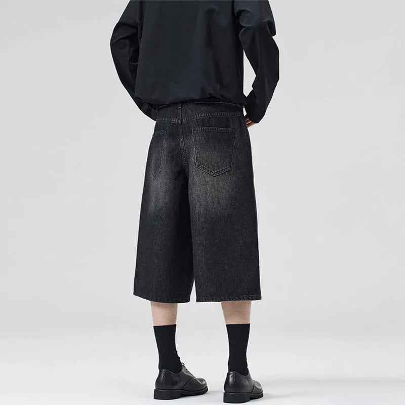 Men's loose fit straight-leg denim shorts in light blue on a plain background