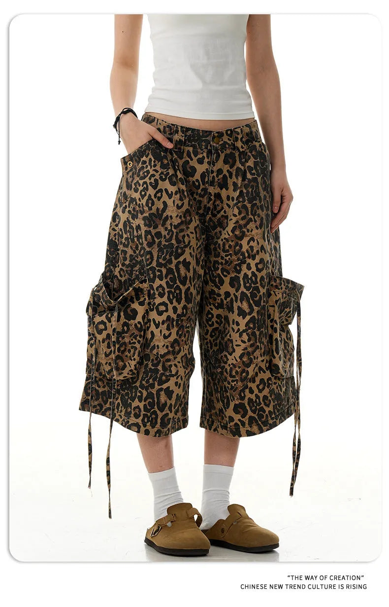 Women's loose straight cropped pants in a leopard print pattern with a high waist and button fly.