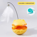 Electric cat tumbler teaser toy in lemon yellow colour on a hardwood floor.