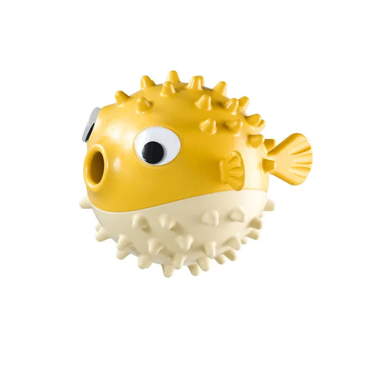 Green fish-shaped interactive dog toy with treat dispensing capability and raised surface particles