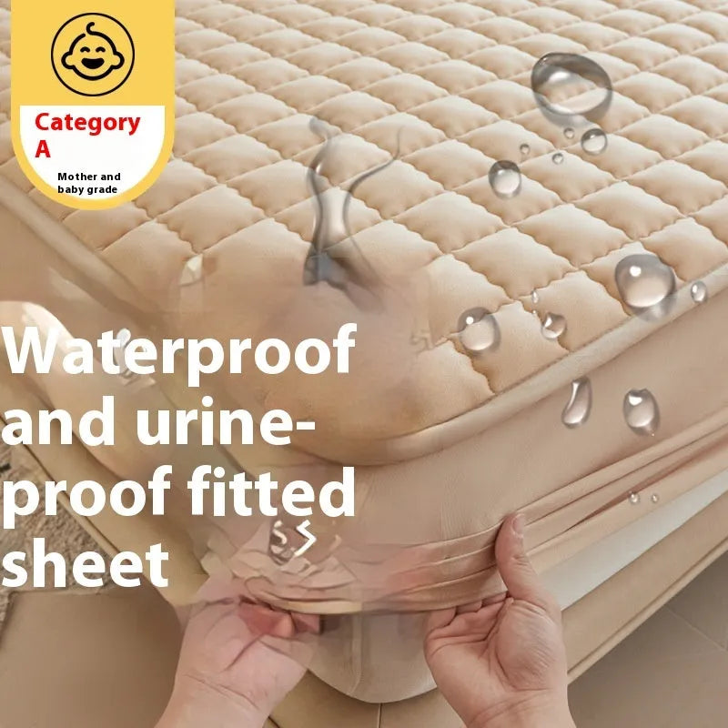 Blue washed cotton fitted sheet with quilted pattern on a bed, showcasing its waterproof protection feature.