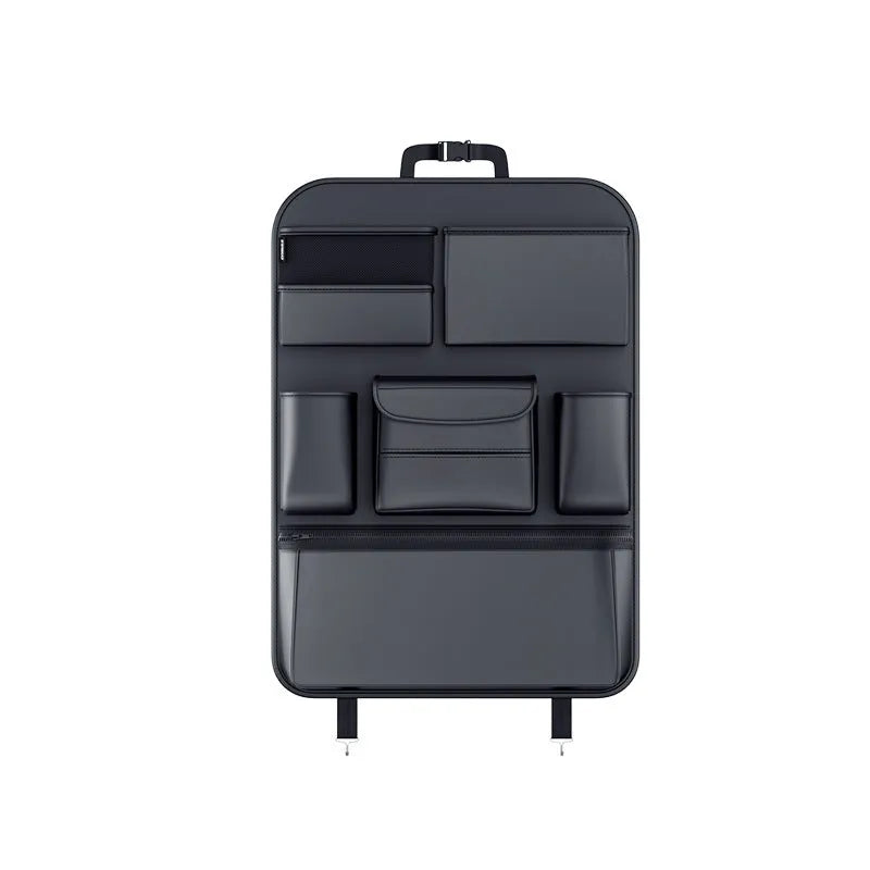Black leather car seat back hanging storage organiser bag with handle shown mounted on a headrest.