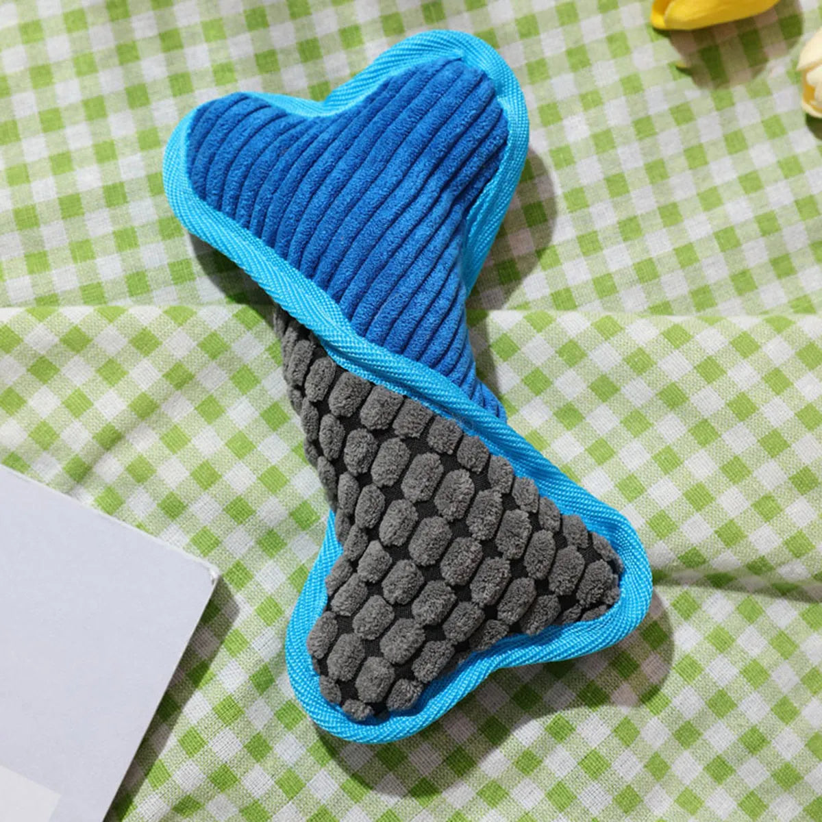 Blue teddy dog toy with sound bone model showing corn fleece lining interior