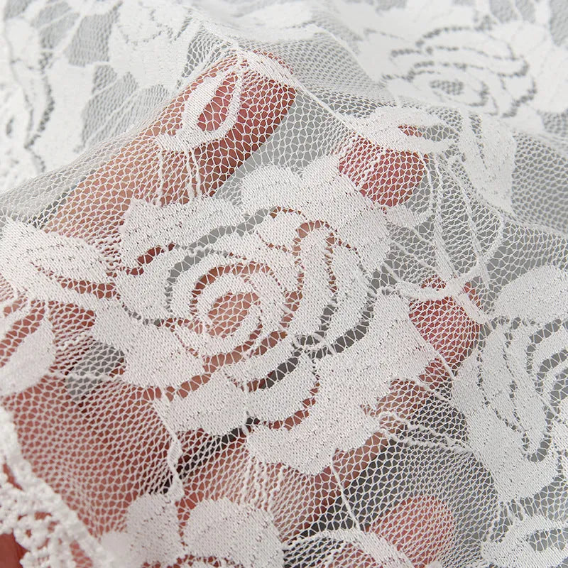 Round white bridal head cover with floral decoration measuring 30cm diameter