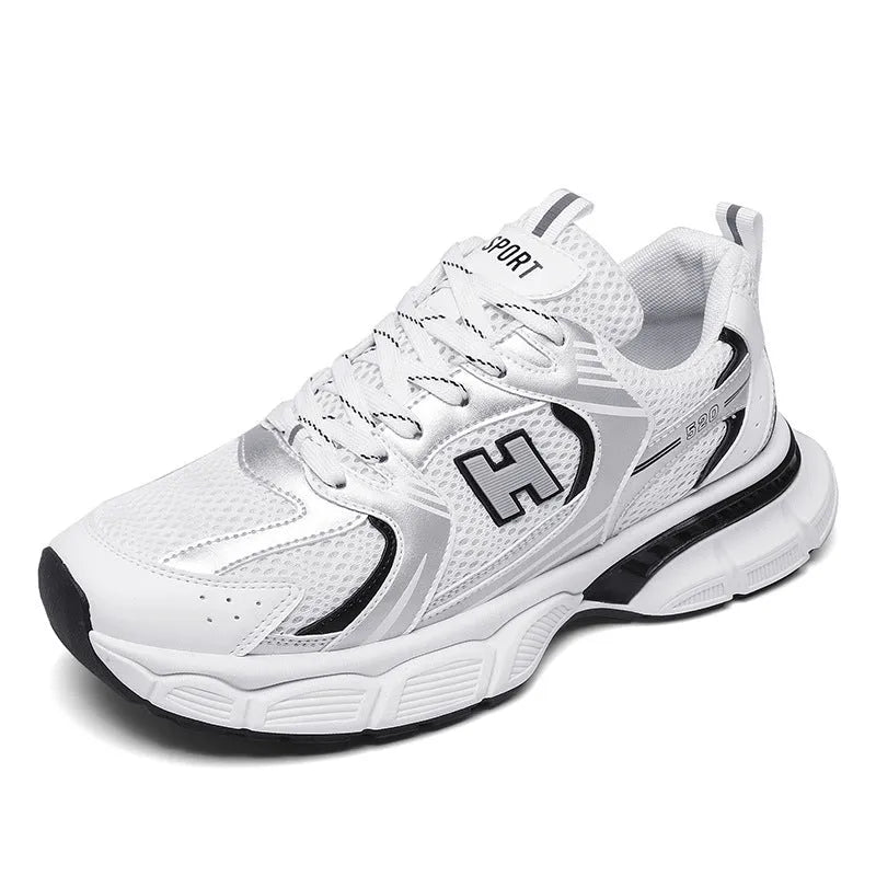 Men's white and grey mesh running shoes with a round toe and plastic sole on a plain background.