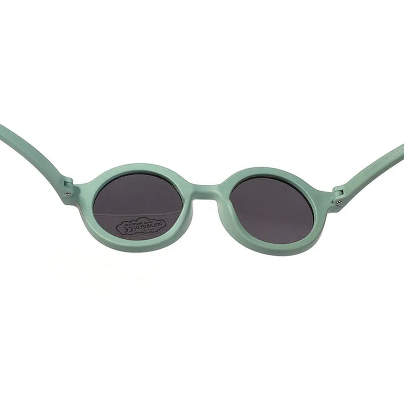 Children's round sunglasses for 0-3 year olds with UV400 protection, shown in a selection of colours.