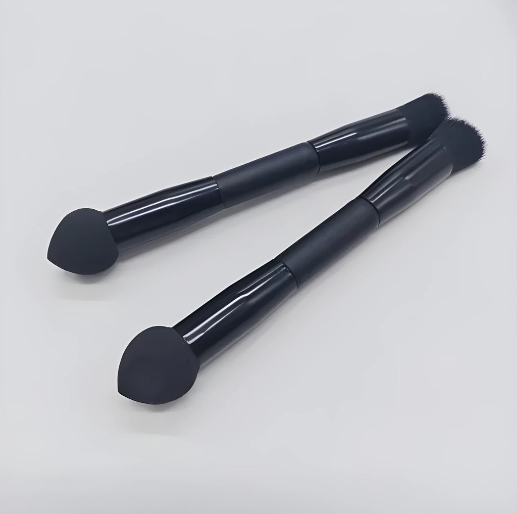 Double-headed black makeup brush with a pointed concealer brush on one end and an angled sponge on the other.