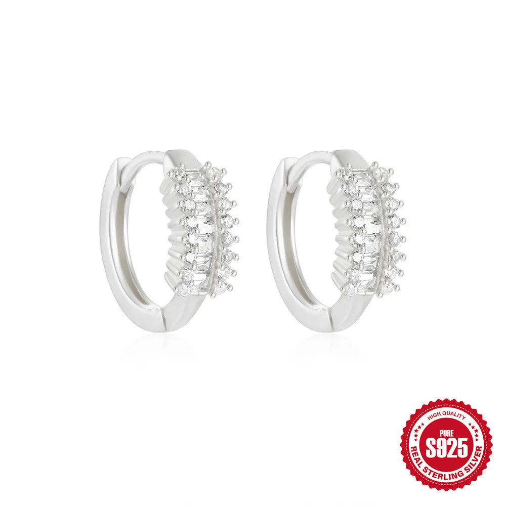 Small round geometric sterling silver stud earrings in gold and silver electroplated finishes.